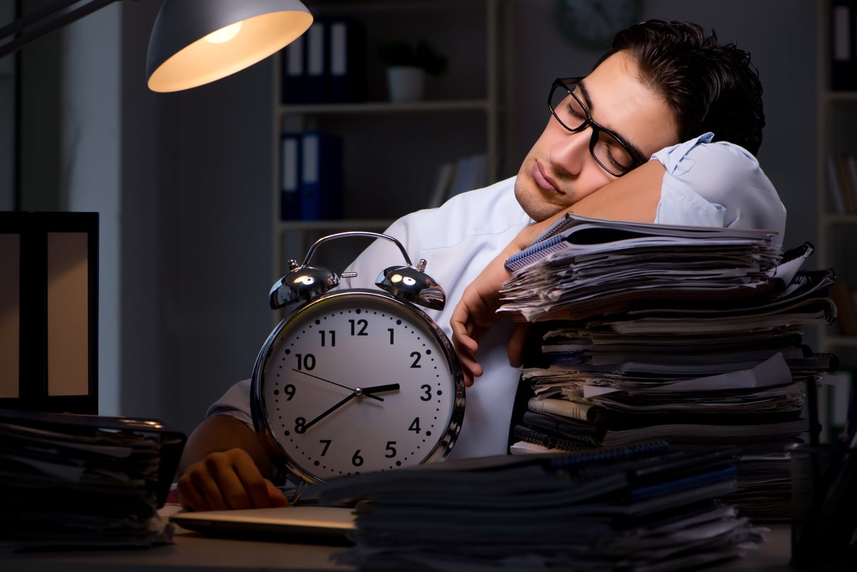 Young Businessman Working Overtime Late in Office